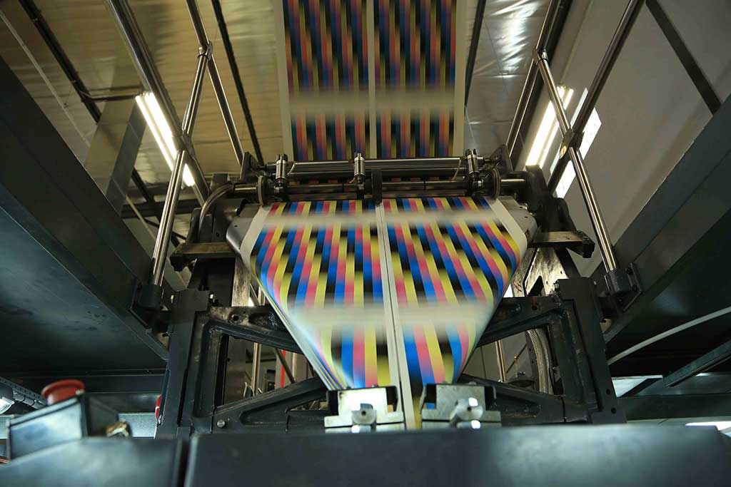 The printed web running through the press